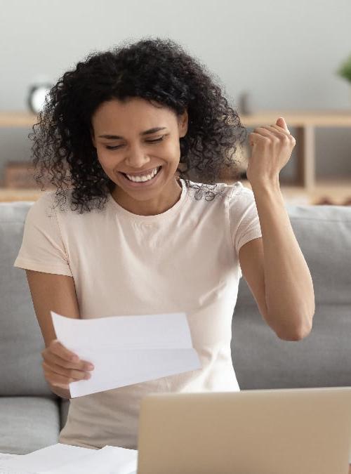 women looking at papers happy about new loan-01